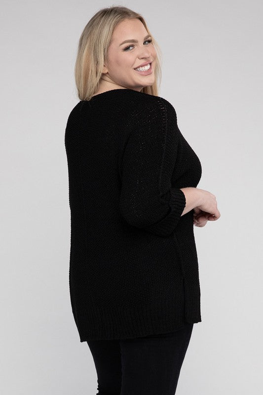 Black plus size crew neck sweater with a loose fit, side slits, long sleeves, and a cozy knit fabric for warmth.