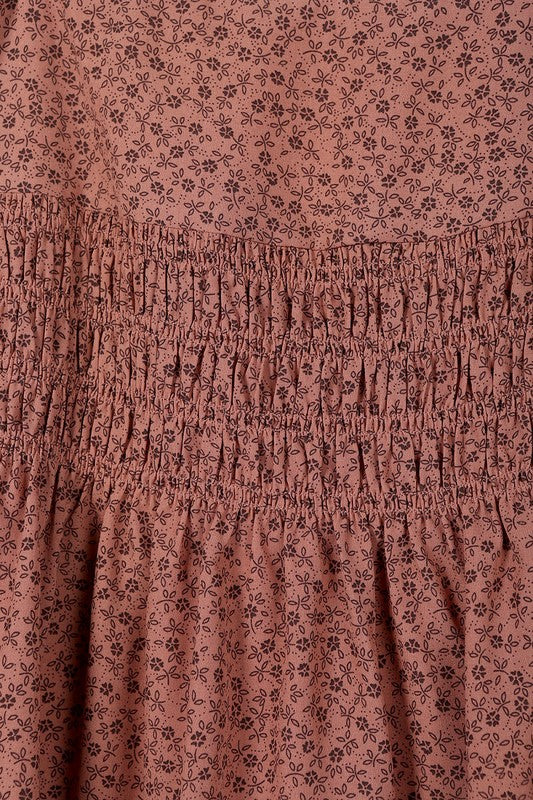 Brown floral smocked skirt with pleats, side zipper, and lining for coverage.