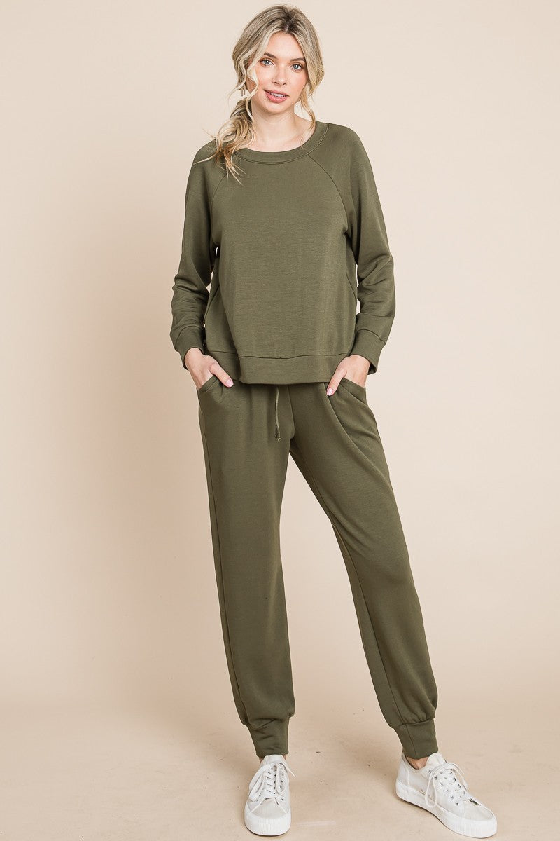 Olive lounge set with a round-neck top, raglan sleeves, and drawstring pants.