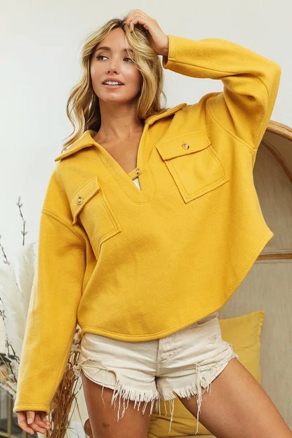 Honey mustard fleece collared sweatshirt with button front and pocket details