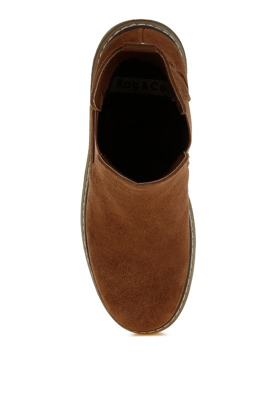 Overhead view of brown suede Chelsea boots with elastic gusset