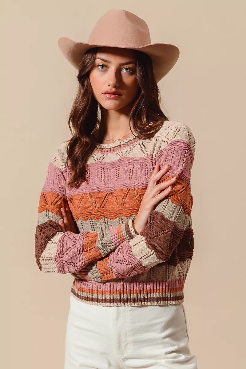 Model in Nina Multi Color Wavy Stripe Sweater Top showing bright and cozy style.