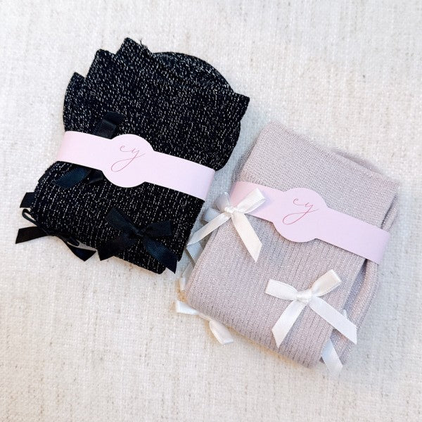 Folded black and pink Shimmer Chic Bow Socks highlighting bow embellishments.