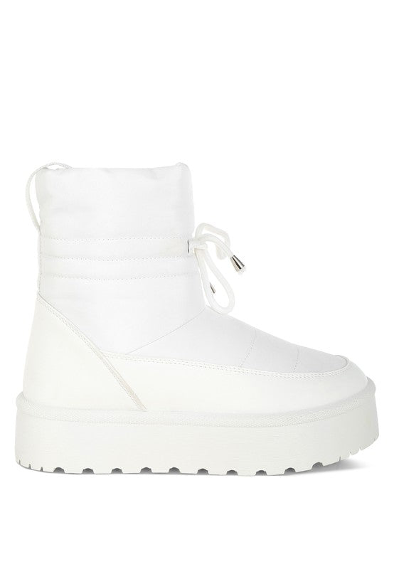 White Pacos Snow Boots side front angle showing lace-up and pull tab.