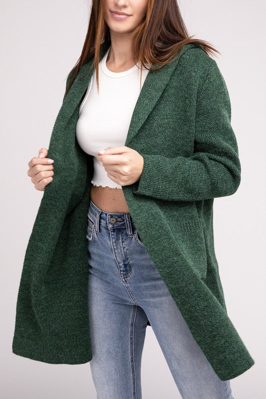 Dark Green sweater cardigan with long sleeves, front pockets, and a hooded neckline. 