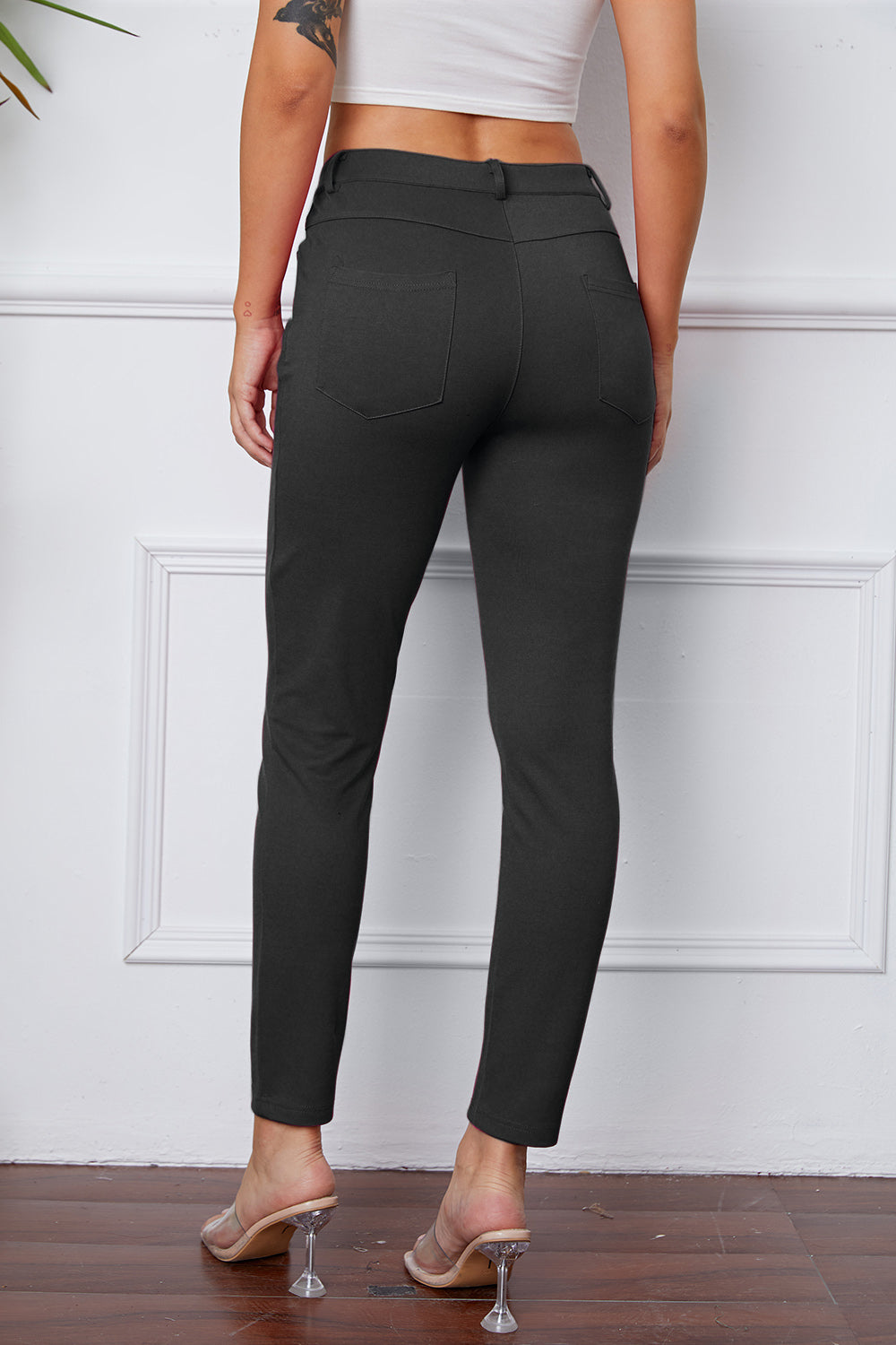 Heather Gray stretchy high-waisted pants feature pockets, a zip fly, and belt loops. 