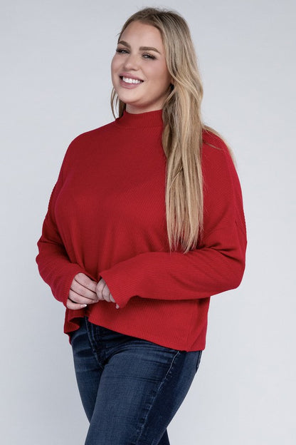 Plus size model wearing Raya Curvy Plus Drop Shoulder Top in red with mock neck,.