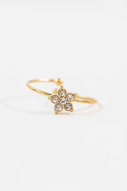Stella Adjustable Star Ring gold band with star-shaped charm and sparkling stones, front view