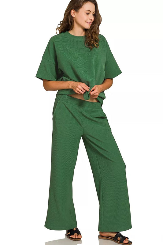 Side angle Tori Ribbed Round Neck Tee & Pants Set Dark Green, ribbed two-piece outfit with pockets.