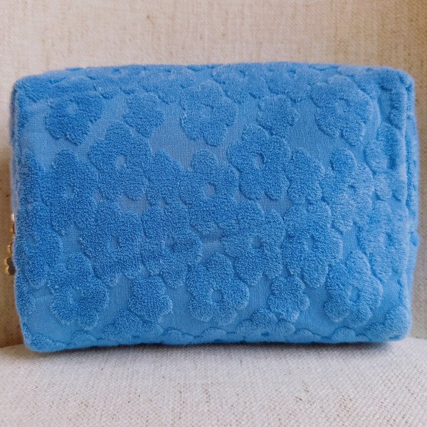 Blue Embossed Daisy Blossom Cosmetic Case featuring golden daisy zipper detail.