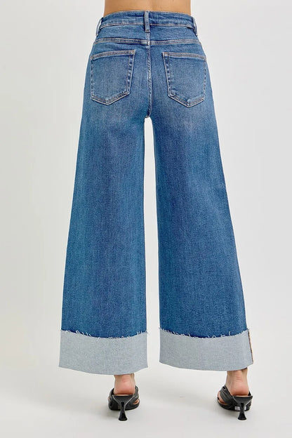 Medium wash Sylvi wide cuff jeans with high rise tummy control and cropped wide leg.