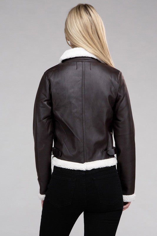 Brown vegan leather jacket with cozy teddy trim, zipper closure, and side pockets.