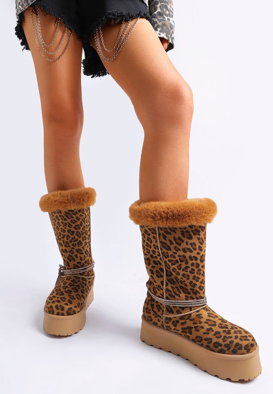 Leopard boots front angle on model, emphasizing closed round toe and tread.