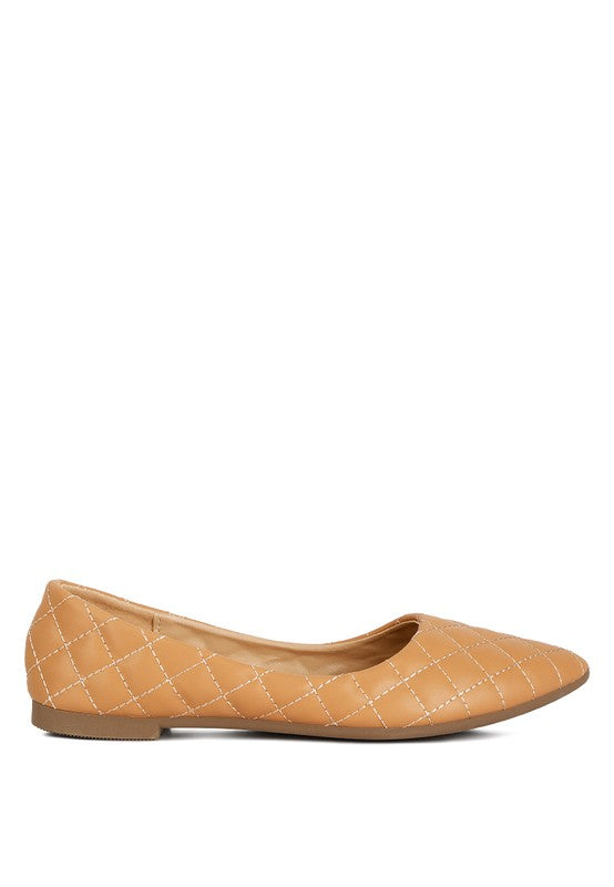 Side profile of beige quilted ballet flats with cushioned insole.