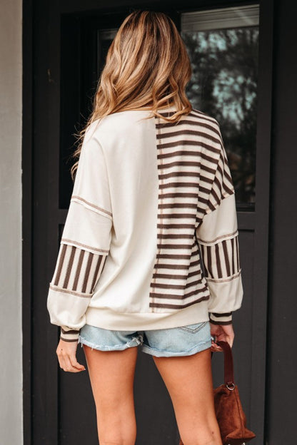 Back view of Ariana Stripe Stitched Oversized Sweatshirt showing half solid, half striped design