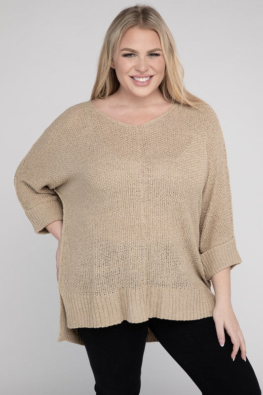 Oatmeal plus size crew neck sweater with a loose fit, side slits, long sleeves, and a cozy knit fabric for warmth.