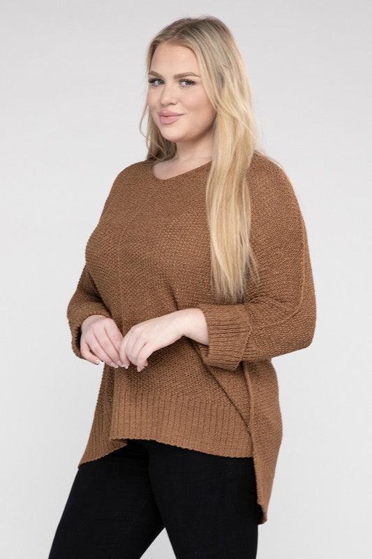 Coco plus size crew neck sweater with a loose fit, side slits, long sleeves, and a cozy knit fabric for warmth.