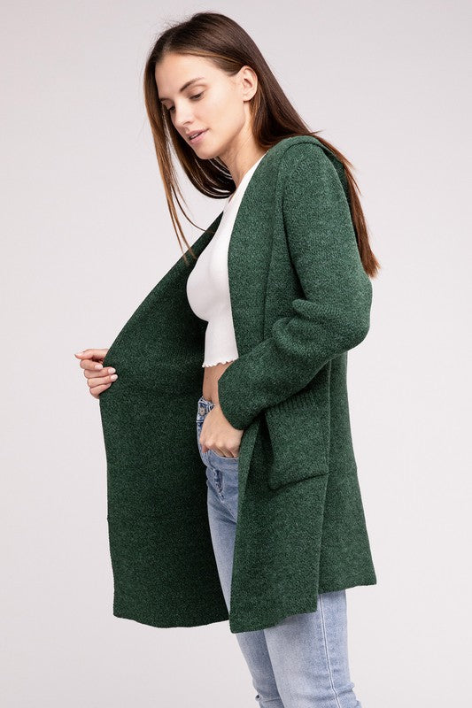 Dark Green sweater cardigan with long sleeves, front pockets, and a hooded neckline. 