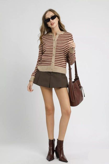 Magda striped knit cardigan, front button design in tan red tones.
