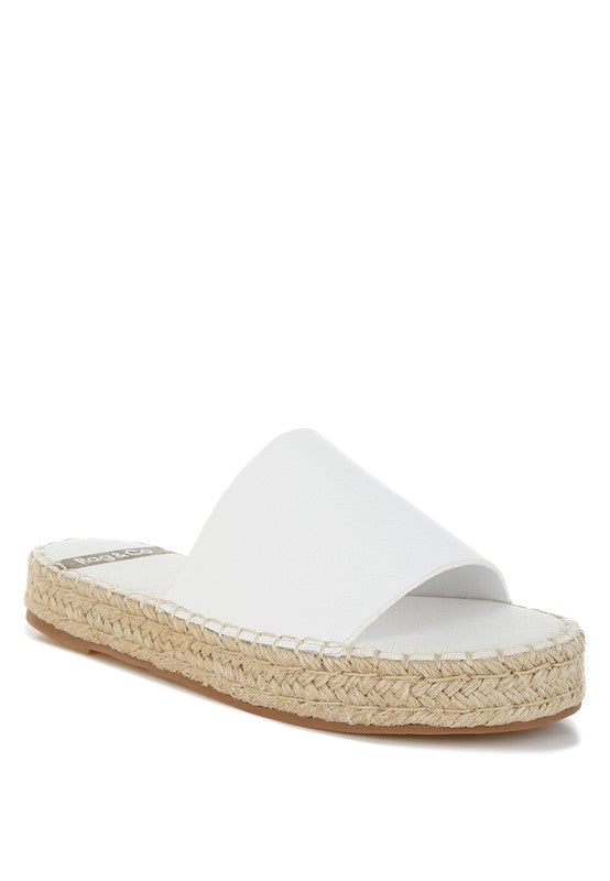 Front angle of Scalar White Leather Flatforms with open round toe, jute-wrapped heel, and cushioned leather footbed.