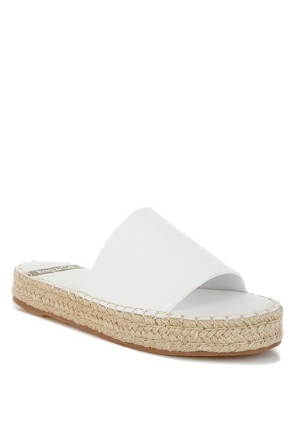 Front angle of Scalar White Leather Flatforms with open round toe, jute-wrapped heel, and cushioned leather footbed.