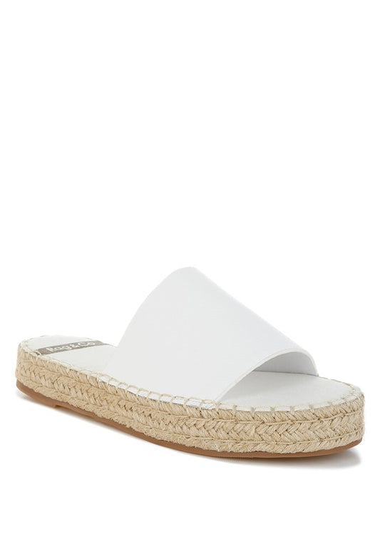 Front angle of Scalar White Leather Flatforms with open round toe, jute-wrapped heel, and cushioned leather footbed.