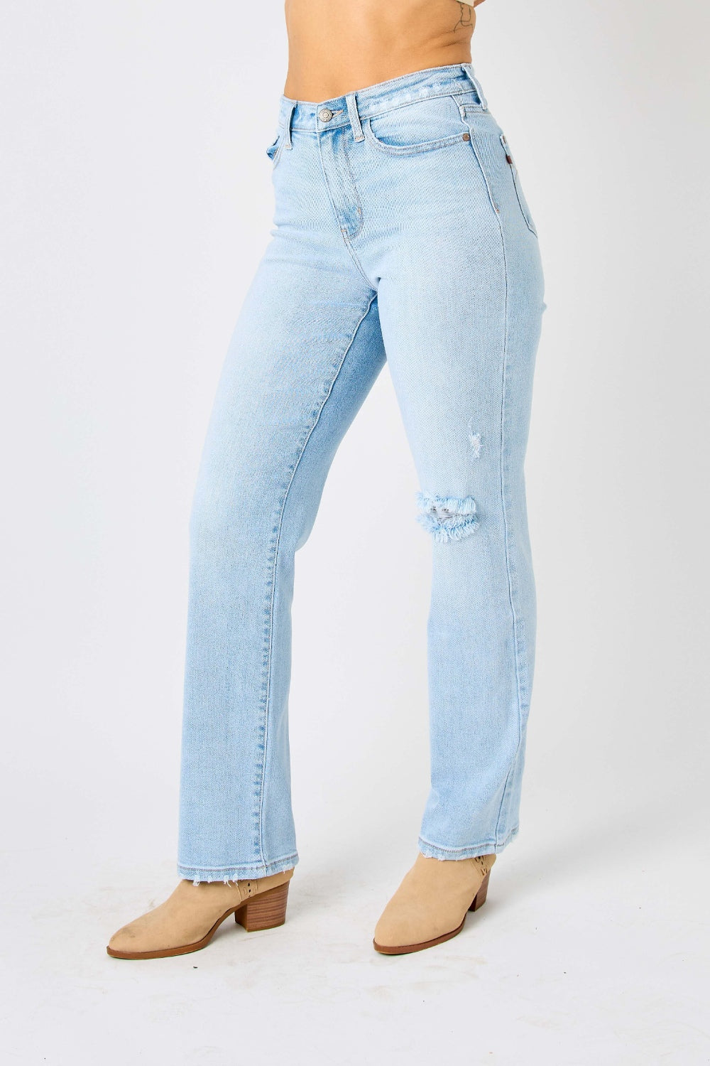 High waist distressed straight jeans in light wash. Slightly stretchy with a zip fly closure.