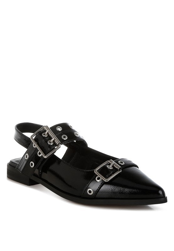 Black flats with a pointed toe, adjustable buckle straps, eyelet detailing, and a slingback design. Features a cushioned insole and 1-inch flat heel for comfort.