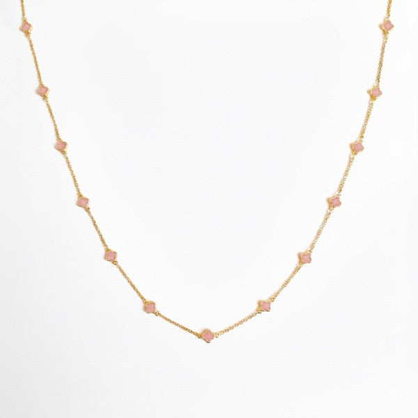 Petite Colored Clover Necklace front view showing minimalist pink and gold clover design.