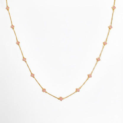 Petite Colored Clover Necklace front view showing minimalist pink and gold clover design.