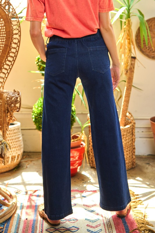 Dark wash high-waisted wide-leg jeans with a vintage-inspired 6-button fly and stretch denim for a flattering fit.