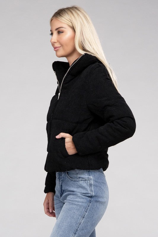 Black corduroy zip-up jacket with a high collar, long sleeves, and a pocket.