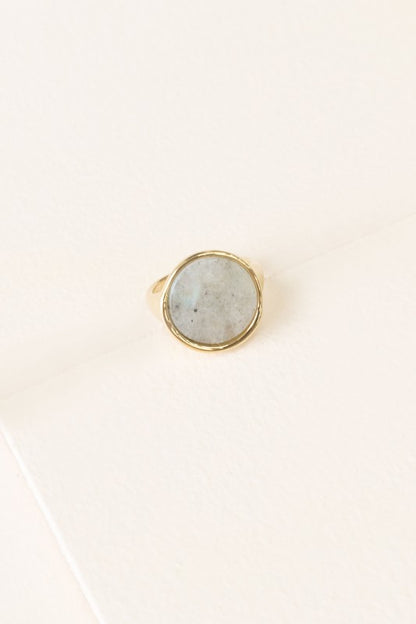 Top view of Ambition Stone Ring in Haze with light gray stone in round gold setting.