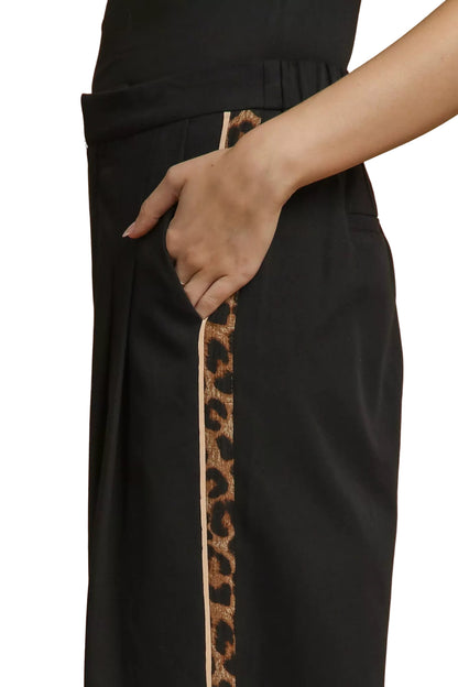 Close-up of pocket and leopard contrast trim on Cedar pants