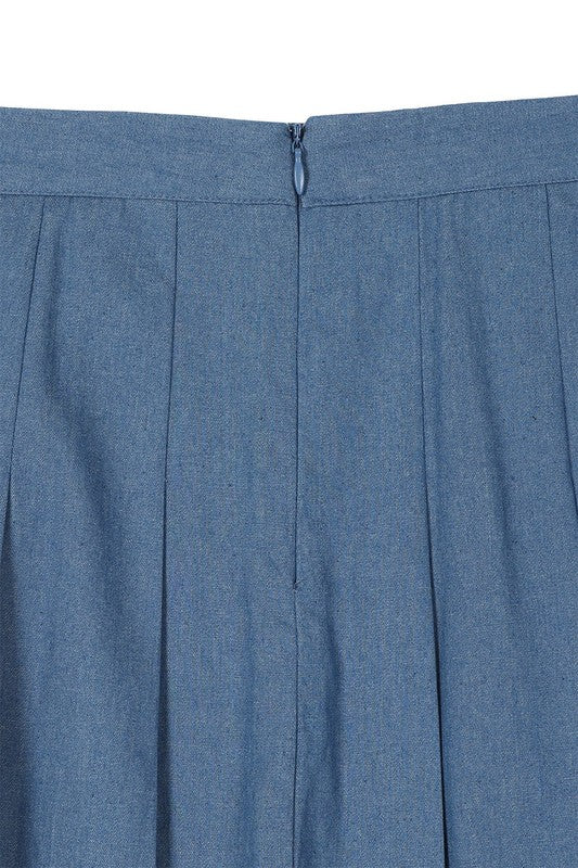 Blue high-waist, pleated, mini tennis skirt, with back zipper closure.