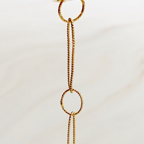 Diamond-cut textured chain links in gold shown close up for shimmer detail