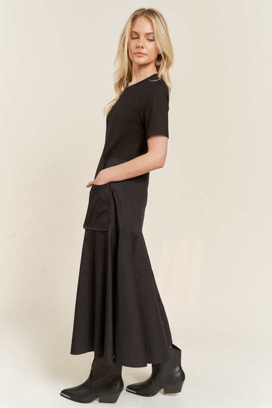 Side view of Felicity Plus Size Knit Mix Dress in black showing flowy cotton skirt