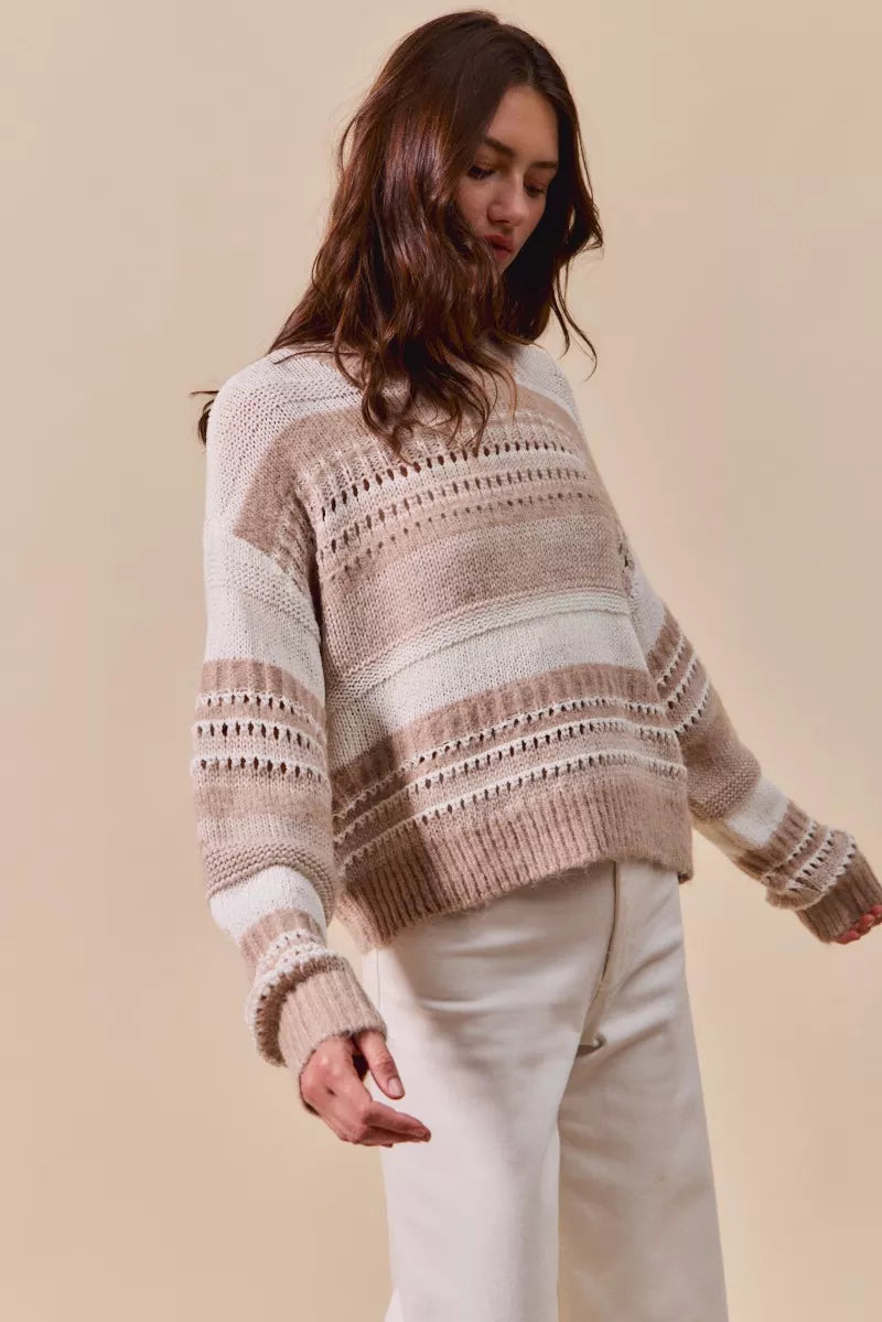 Side view of Bina Variegated Stripe Sweater highlighting relaxed fit and openwork texture.