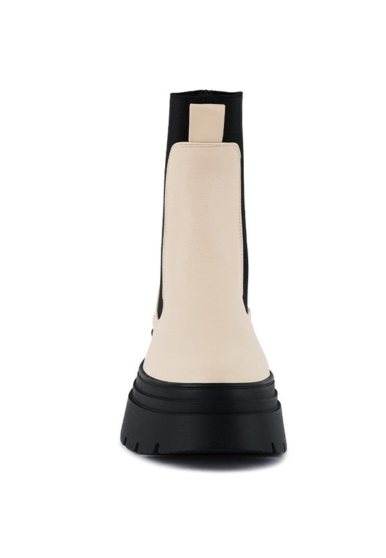 Front-facing Ronin Chelsea boot with round toe and contrast sole.