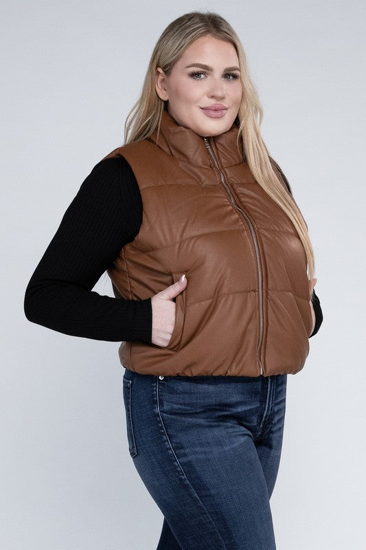 Plus Size Puff Vest in brown, featuring a relaxed fit, zip closure, pockets, and a collar neckline. Stylish and functional, this sleeveless waist-length vest is perfect for casual cold-weather layering