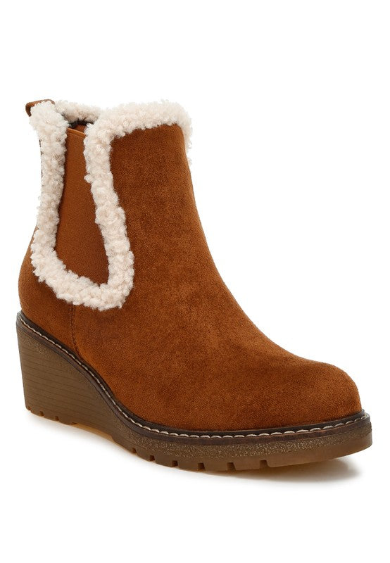 Tan Thunderhoof Chelsea Boots with faux fur lining, wedge heel, and cushioned insole.