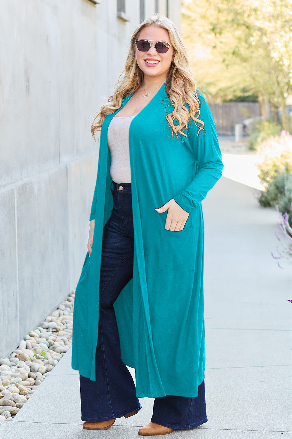 Sky Blue open-front long-sleeve cover-up with a flowy design and pockets, perfect for layering on breezy days.