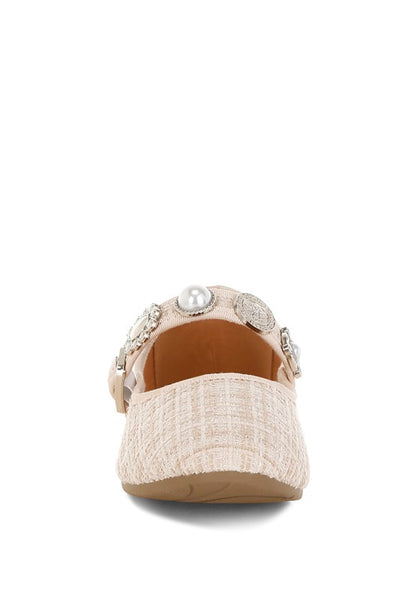 Front view of beige Noyama Tweed Mary Jane flat showcasing the closed round toe and charm embellishments.