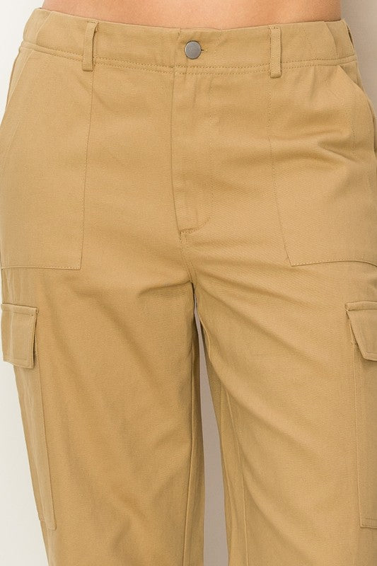 Khaki high-waisted cargo pants with a straight-leg fit, functional side pockets, and zip fly.