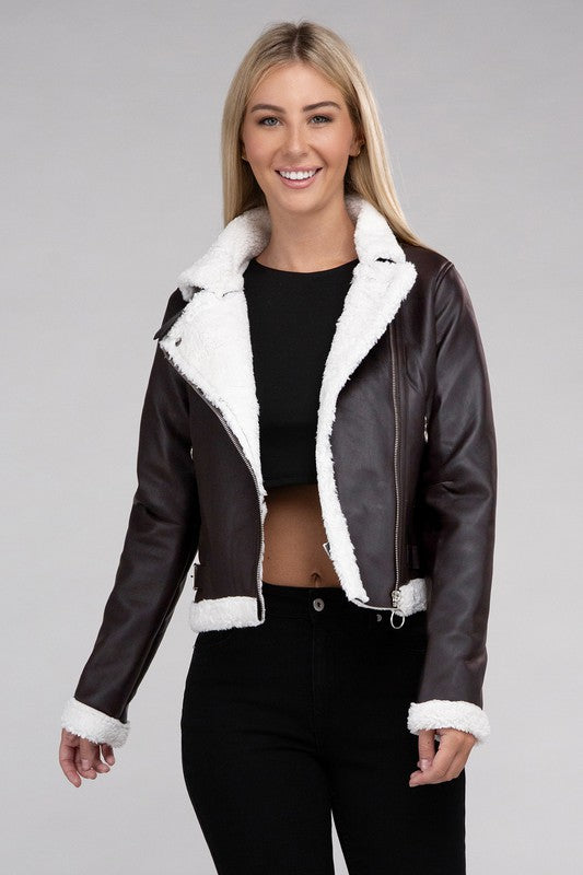 Brown vegan leather jacket with cozy teddy trim, zipper closure, and side pockets.