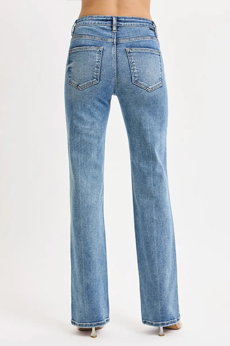 Back view showing pockets, straight leg cut, and flattering high-rise fit of Reese medium wash jeans.