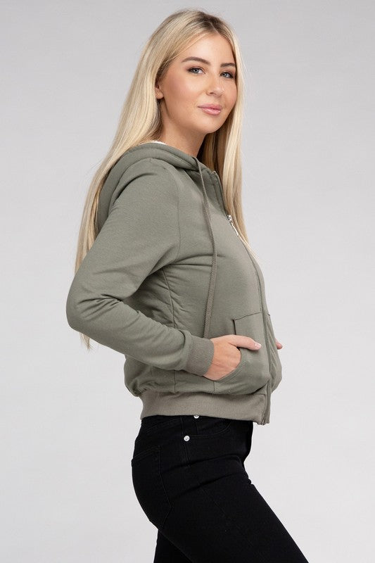 Military green cropped zip-up hoodie with fuzzy trim, pockets, and long sleeves.