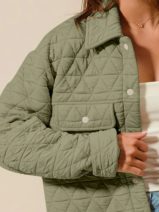Close-up of Serina Quilted Snap Jacket showing snap buttons and pocket detail.