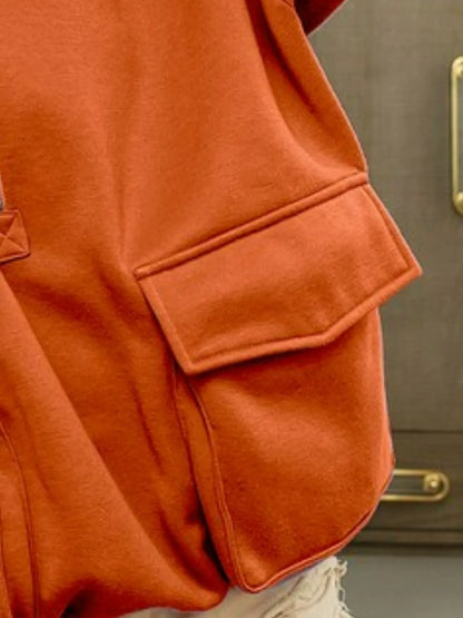 Close-up of the Blaire Fleece Hoodie highlighting the oversized front pocket and soft, vintage-washed fabric texture.