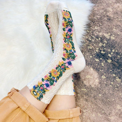 Woman wearing white Noble Floral Beauty Socks styled with intricate floral detail.